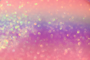 Abstract colorful bright sparkling background, defocused christmas lights. Blurred background for holidays and parties in trendy colors.