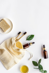 Self-care with herbal formulations - essential oils and soap - on white background top view copy space