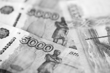 Russian banknotes of five thousand rubles close-up. Monochrome money background