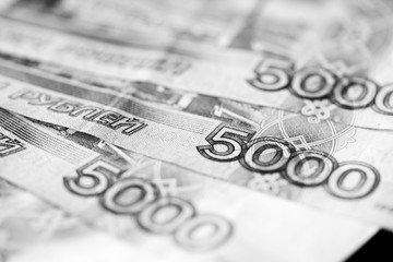 Russian banknotes of five thousand rubles close-up. Monochrome money background