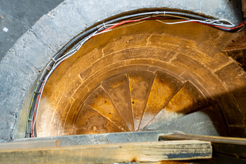 Medieval stone staircase in an old tower. View from above.