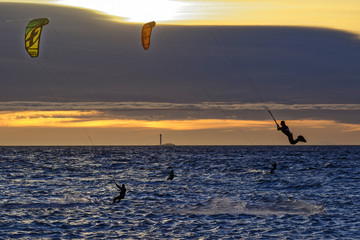 Kite-surfers at dusk