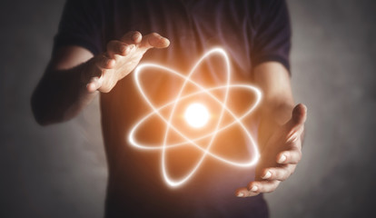 Man holding atom. Energy. Science. Connection