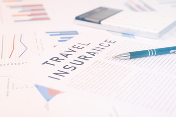travel insurance concept, documents on the desktop