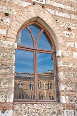 Fototapeta na wymiar Traditional ancient window with reflection