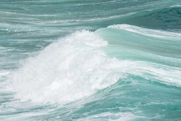 turquoise blue waves breaking