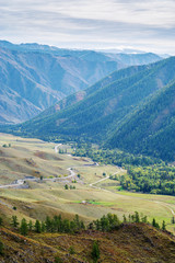 Serpentine mountain road. View of the Chuysky tract from the Chike-Taman pass, Altai mountains, Russia