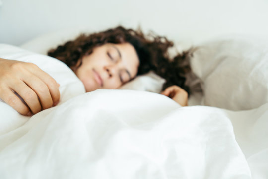 Woman Sleeping In Bed Close Up Blurred