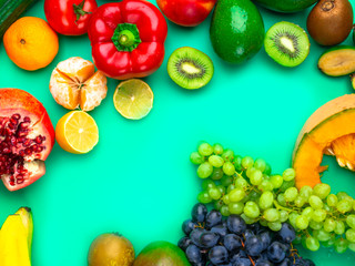 Fruits and vegetables rich in antioxidants, vitamin and fiber on blue background. Flat lay style, selective focus