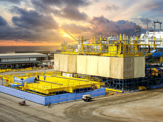 Offshore oil rig platform during construction site in the harbor yard.