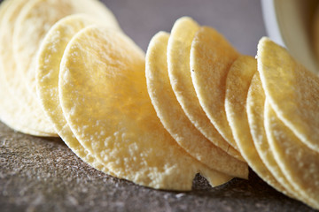 Potato chips on stone table 