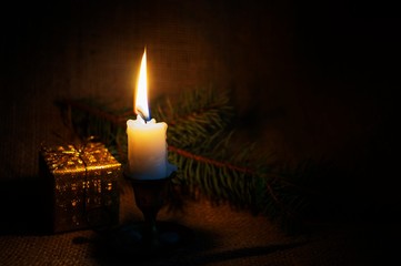 Christmas background with burning candle