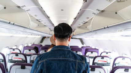 The back view of people walking down the plane that was parked © ArLawKa