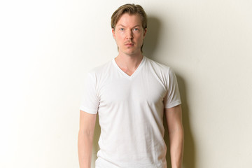 Portrait of young handsome man looking at camera