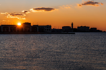 Obraz premium Sunset from the Audace pier of Trieste. Colors of fire on the water. Italy