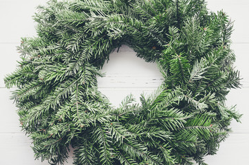 Christmas door wreath made of green tree fir branches