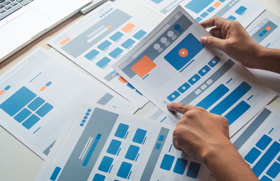 Website designer Creative planning application developer development draft sketch drawing template layout prototype framework wireframe design studio . User experience concept .