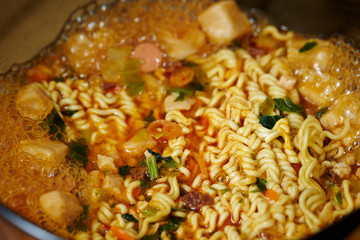 Cooking instant ramen noodle in pot 
