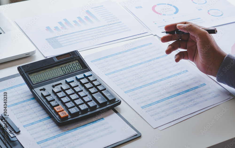 Aufkleber businessman working calculate data document graph chart report marketing research development planni