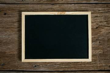 flat lay.Empty chalkboard on Wooden rustic Wall Surface or Old Vintage Planked Wood background.copy space for your text or image. top view