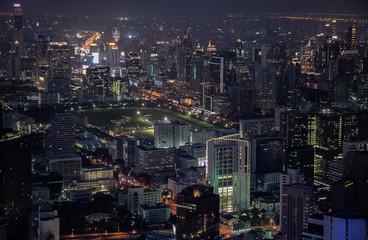 Fototapeta na wymiar panoramic skyline of Bangkok by night from King Power Mahanakhon, Bangkok, Thailand
