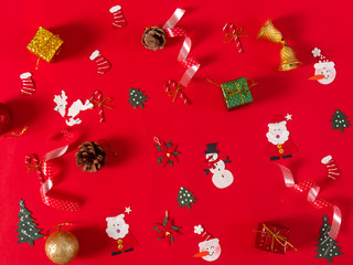Christmas objects on red background.