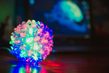 Glowing Christmas ball on a black background
