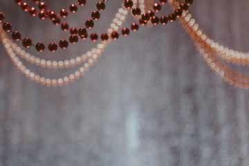 Red and yellow garlands weigh on blurred background