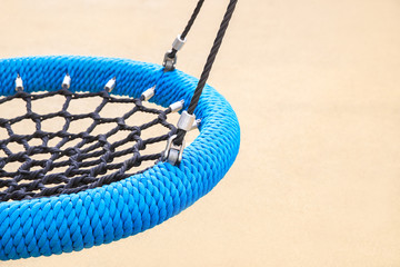 Blue round swing type nest on the Playground. The concept of sports recreation for children and...