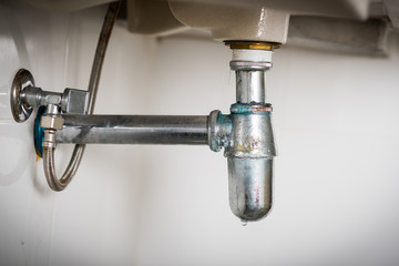 clogged and leaky sink sewer
