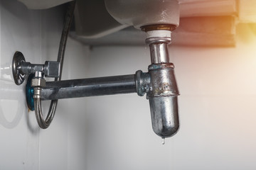 clogged and leaky sink sewer