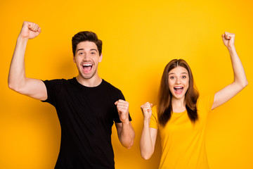 Photo of cheerful crazy excited fascinating beautiful couple rejoicing about their victory...