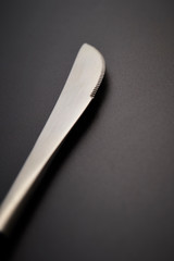 Table knife on black background 