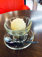 Vanilla ice cream on wooden table