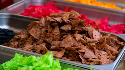 multicolored chips from potatoes background