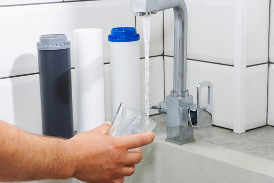 Replacing the water filter. Ecology. Clean water.