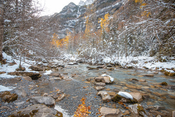Ordesa National Valley in snowy autumn, located in Pyrenees Spain