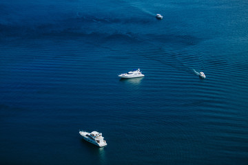 Yachts sail in the calm sea