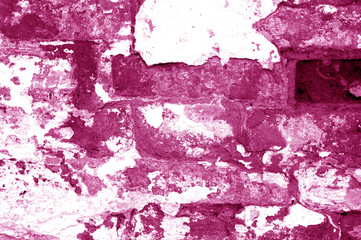 Old grungy brick wall texture in pink tone.