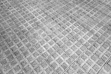 Stone pavement texture with blur effect in black and white.