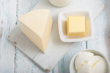 dairy products on old white wooden table