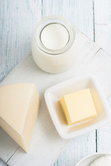 dairy products on old white wooden table