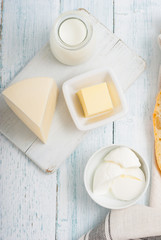 dairy products on old white wooden table