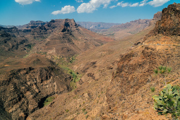 View of the canyon from Degollada de La Yegua viewpoint on San Bartolome de Tirajana, Gran Canaria island in tropical Canary island, Spain in Atlantic ocean. 