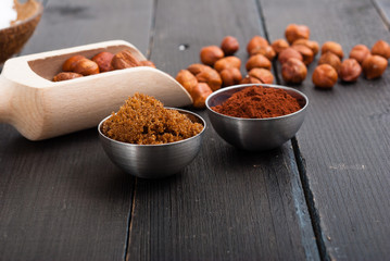 hazelnut cream ingredients on black wooden table