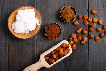 hazelnut cream ingredients on black wooden table