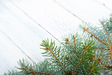pine tree branches frame on old wood table, purity Christmas background