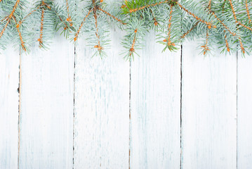 pine tree branches frame on old wood table, purity Christmas background