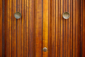 wooden door with golden door handle or knob