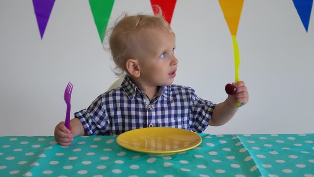 Particular baby boy throw away cherry berry given by mother hand. Gimbal motion